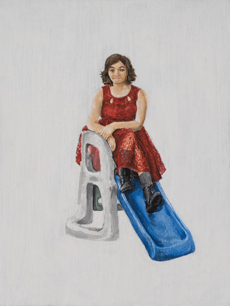 A young woman in a red dress and black boots looks at the viewer while seated on top of a young child's plastic slide.